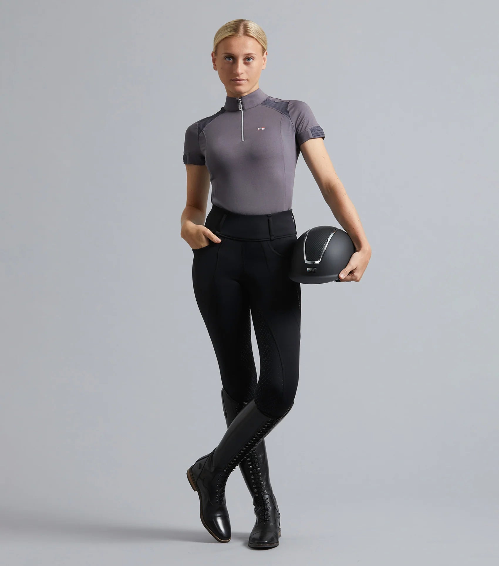 Equestrian riding top by PREMIER EQUINE at Equiflair. Ladies' short sleeve technical shirt in anthracite grey. Shop now!