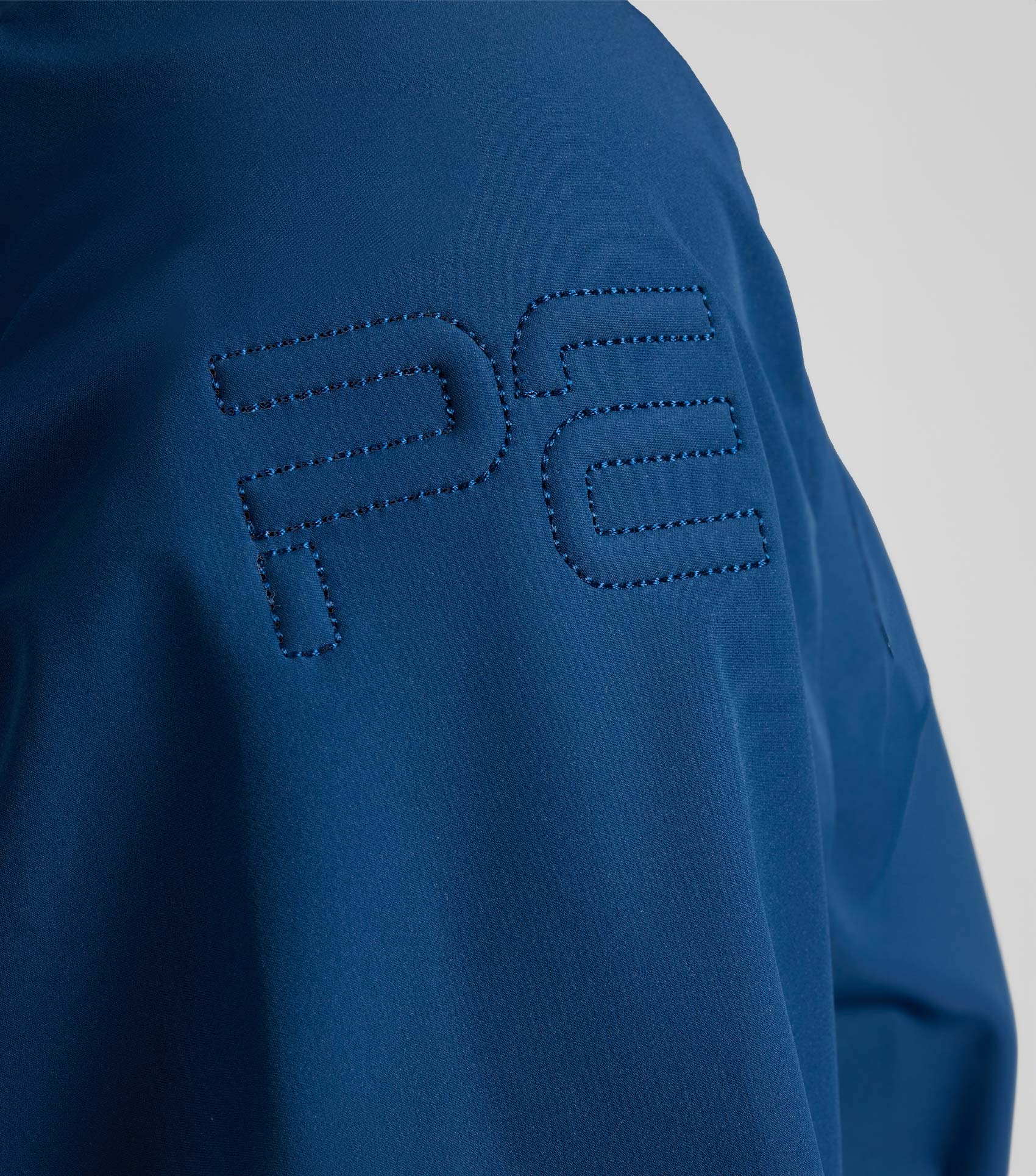Premier Equine Spinto Waterproof Jacket, Imperial Navy. Equestrian Gear. Black Label PE branding.