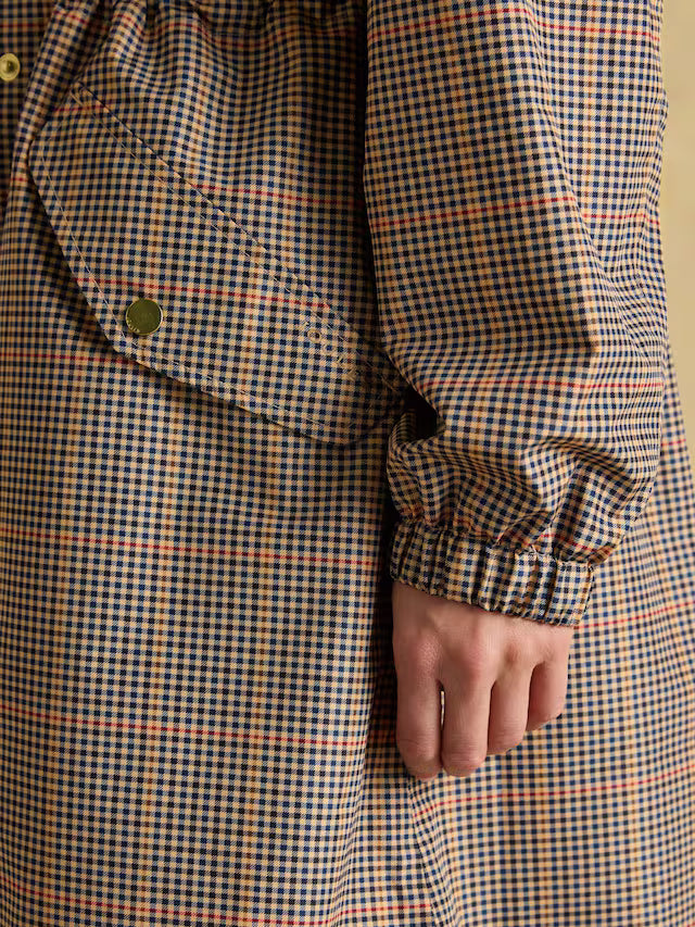Joules Holkham Henson Check Pack-Away Waterproof Jacket Detail: Checkered Fabric, Pocket, Cuff, and Packable Design