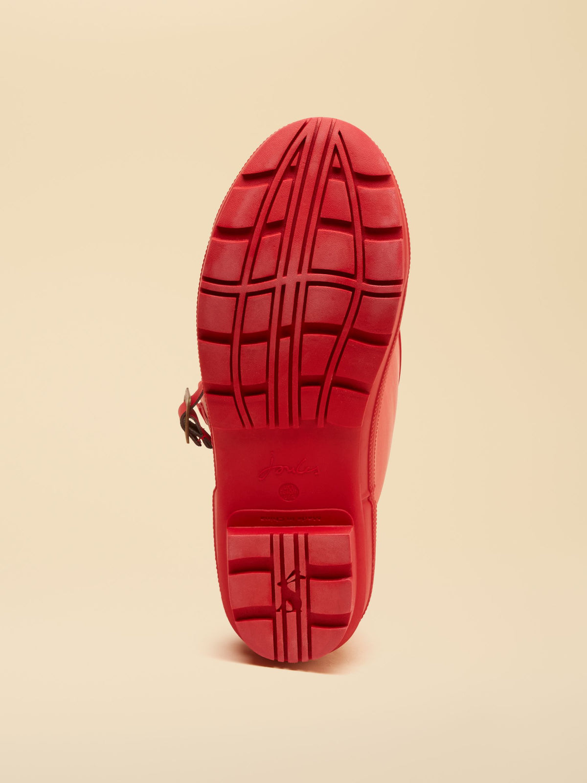 Red Joules tall wellington boots sole with tread pattern and Joules branding