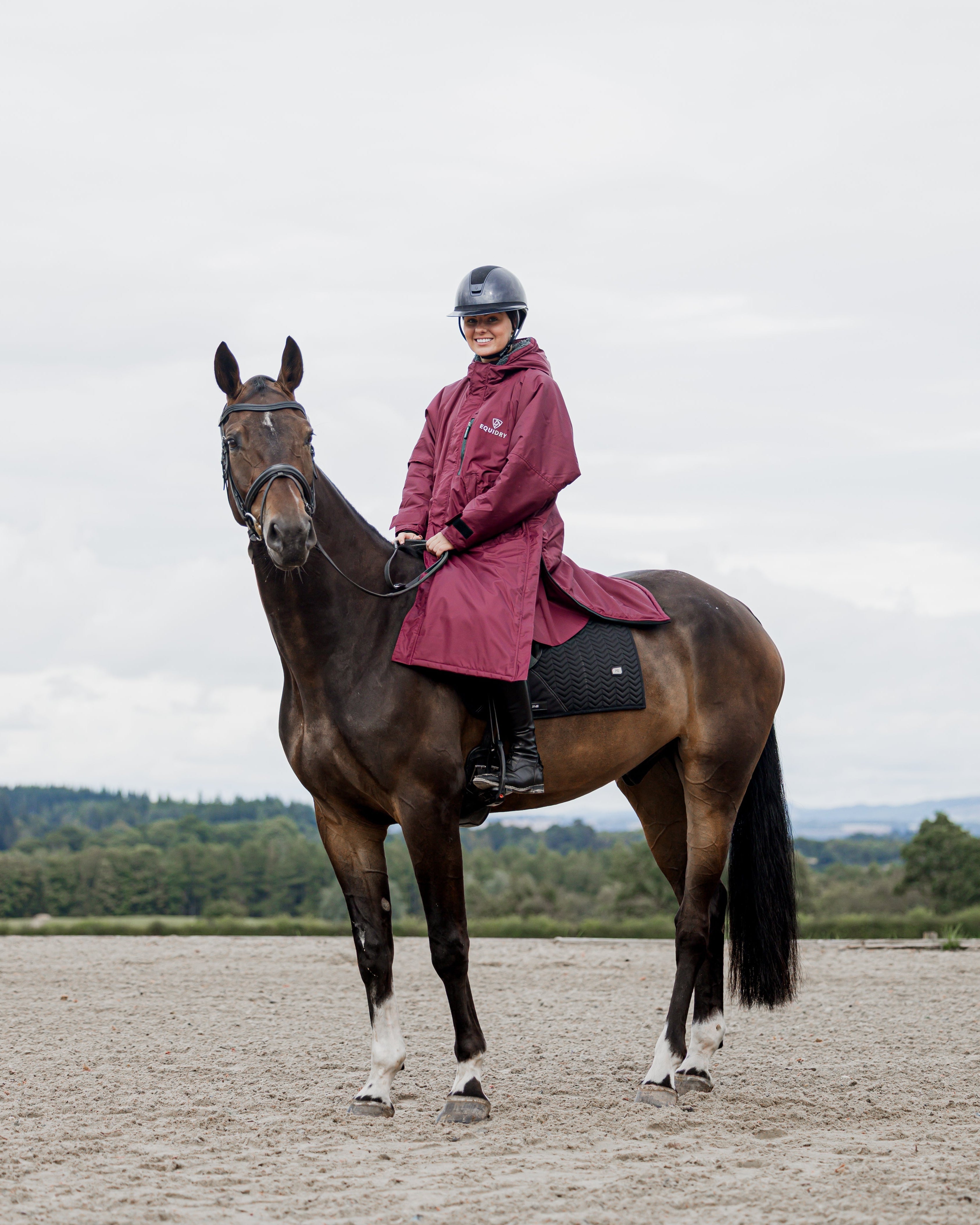 EQUIDRY Plum Horse Riding Coat: Woman in Waterproof Outerwear on Horseback