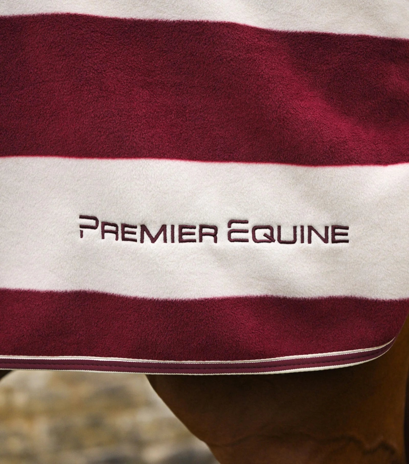 PREMIER EQUINE Burgundy/White Fleece Exercise Rug. Horse riding equipment. Keeps your horse warm in cooler weather.
