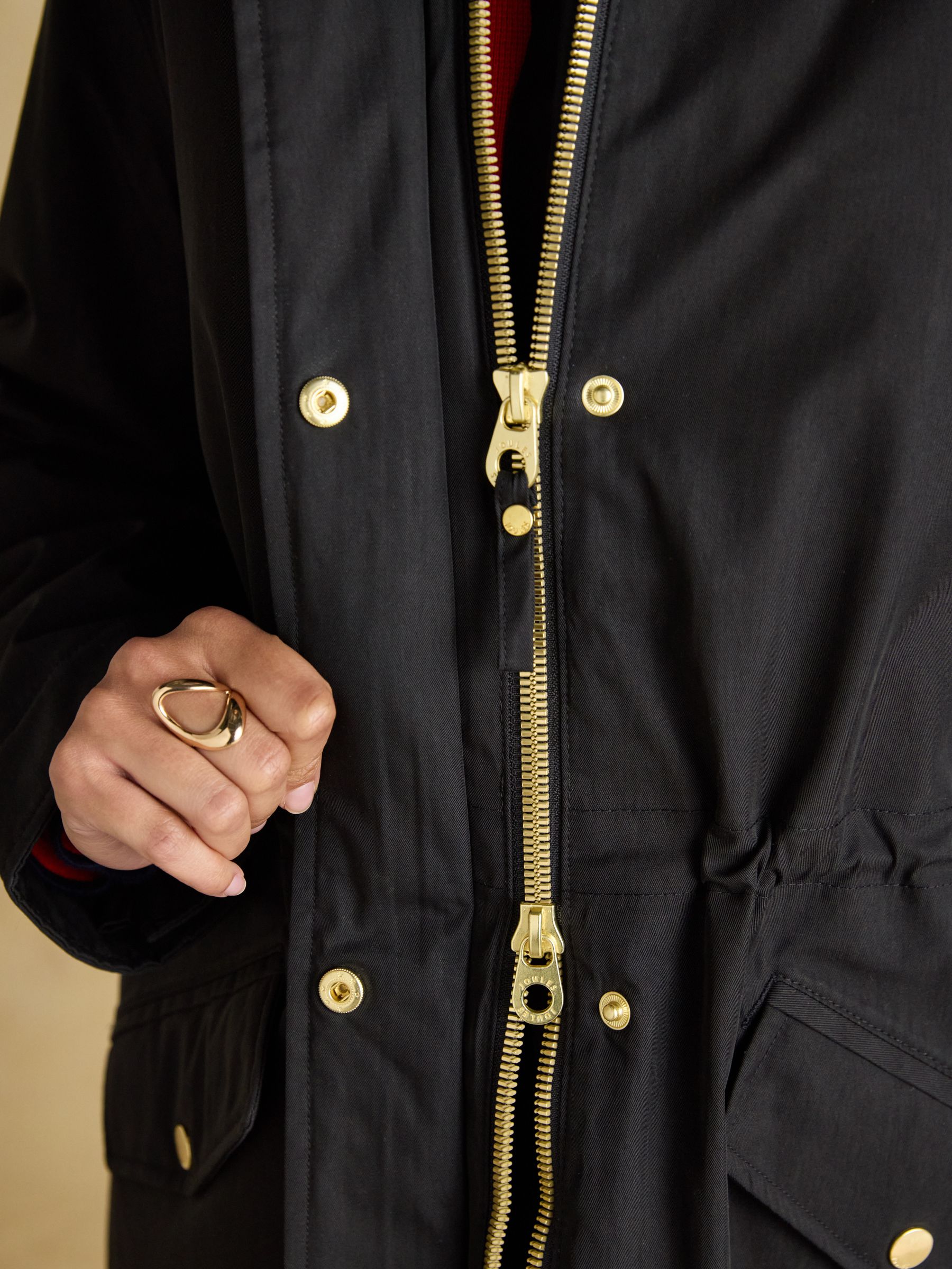 Joules Portwell black fleece-lined waterproof raincoat with gold zipper detail