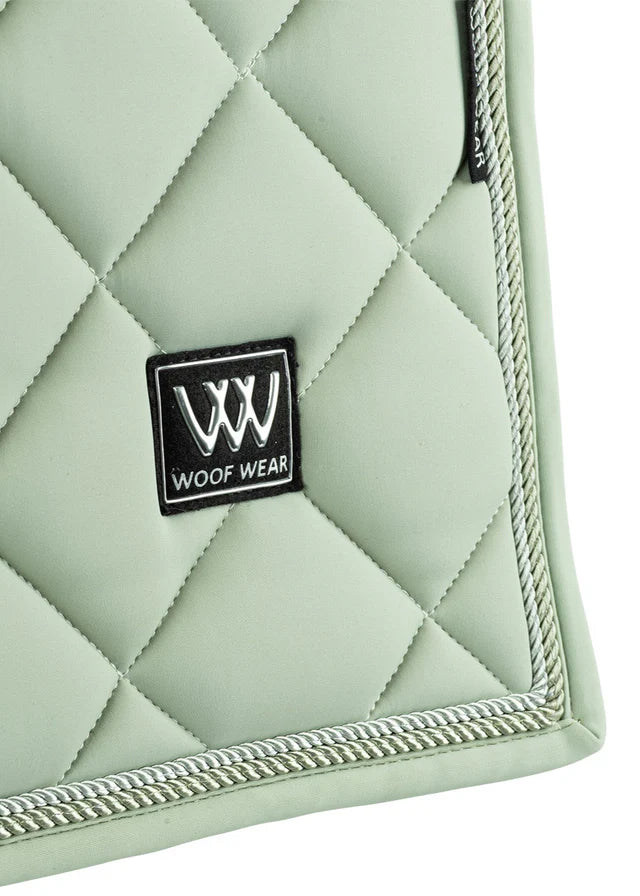 WOOF WEAR Aura Dressage Saddle Pad - Sage Green Horse Riding Equestrian - Close Up of Quilting and Logo
