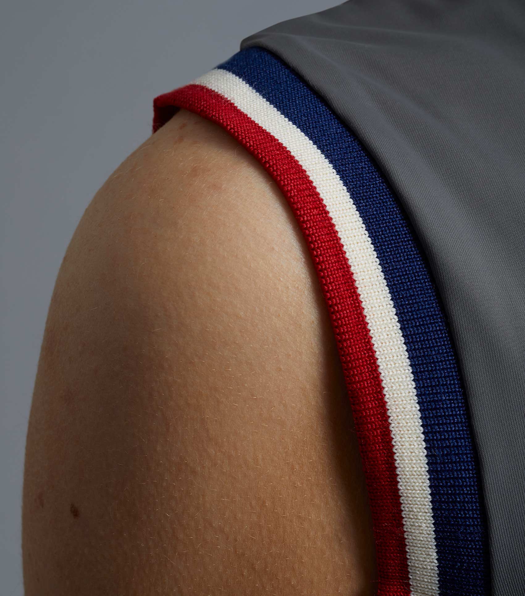 Premier Equine Alito Ladies Sleeveless Riding Top Anthracite, close-up of shoulder and red/white/blue trim detail