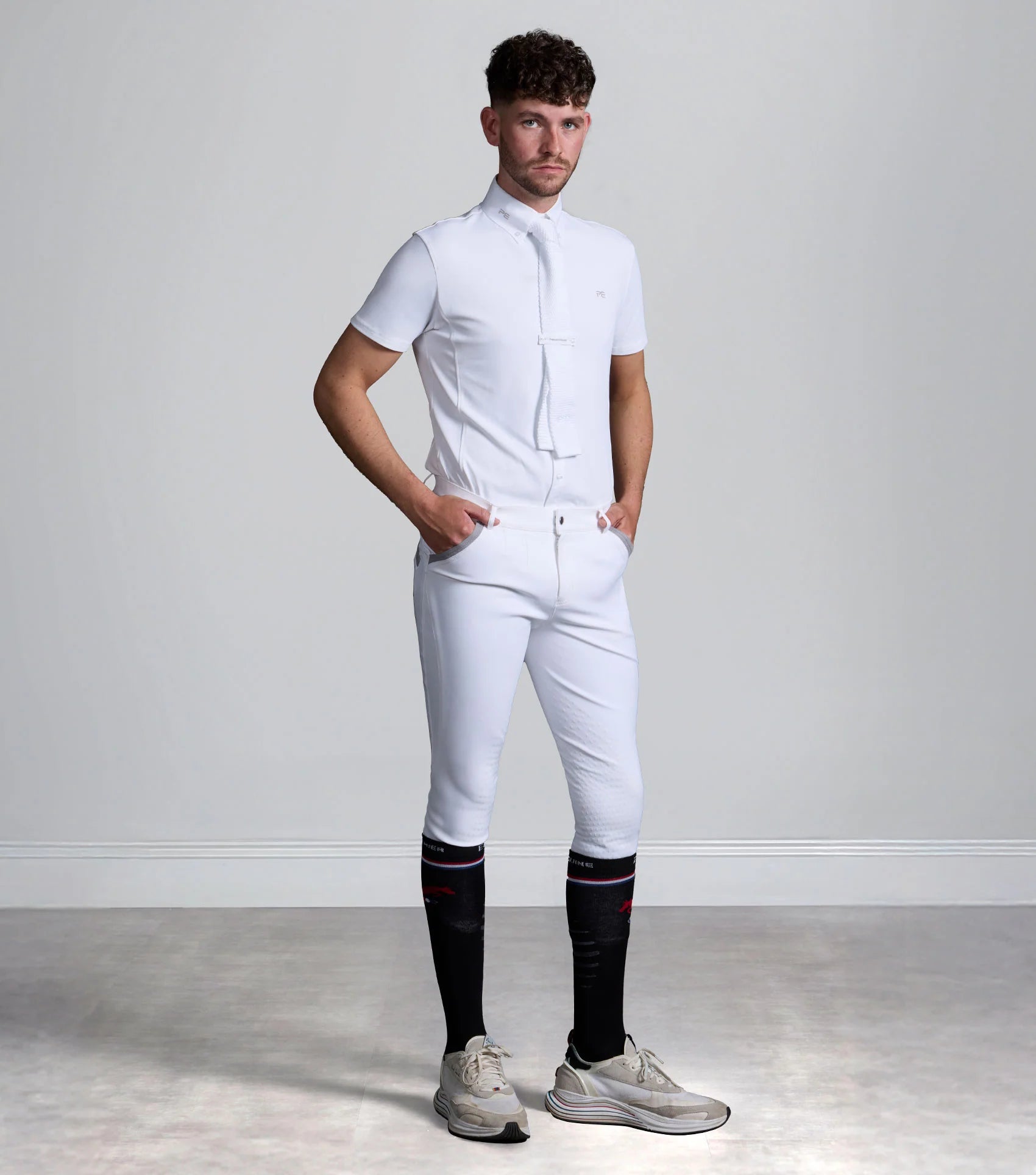 Premier Equine Barusso Men's Gel Knee Competition Breeches White. Stylish and comfortable riding breeches for equestrian athletes.