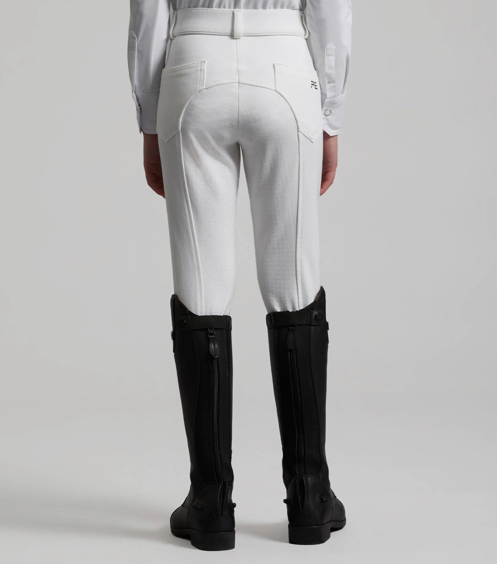 Girl in White Riding Breeches & Black Boots: Premier Equine Brava Competition Breeches, Full Seat Gel, Equestrian Apparel
