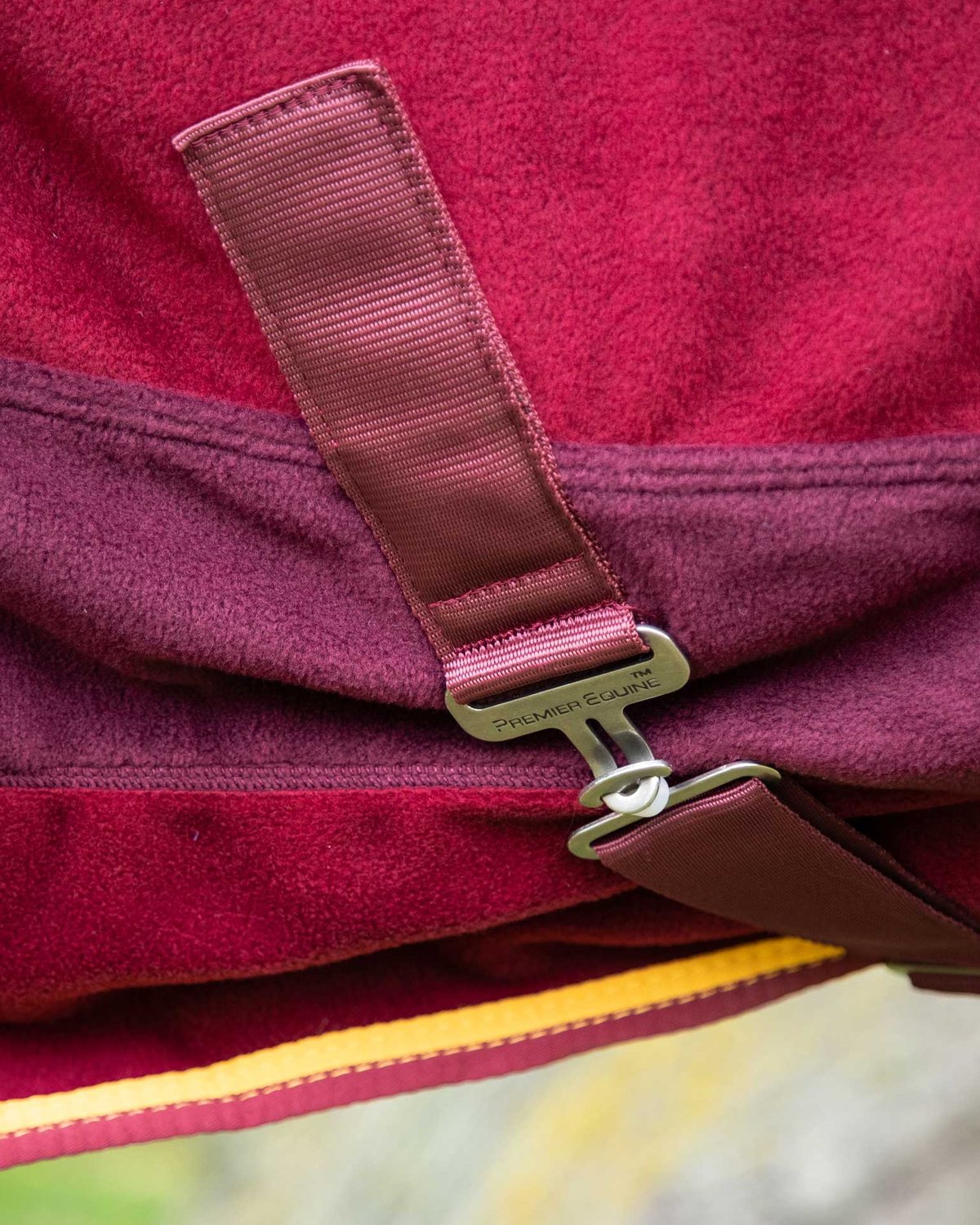 Burgundy Premier Equine Fleece Cooler Rug: Strap & Buckle Detail - Horse Clothing