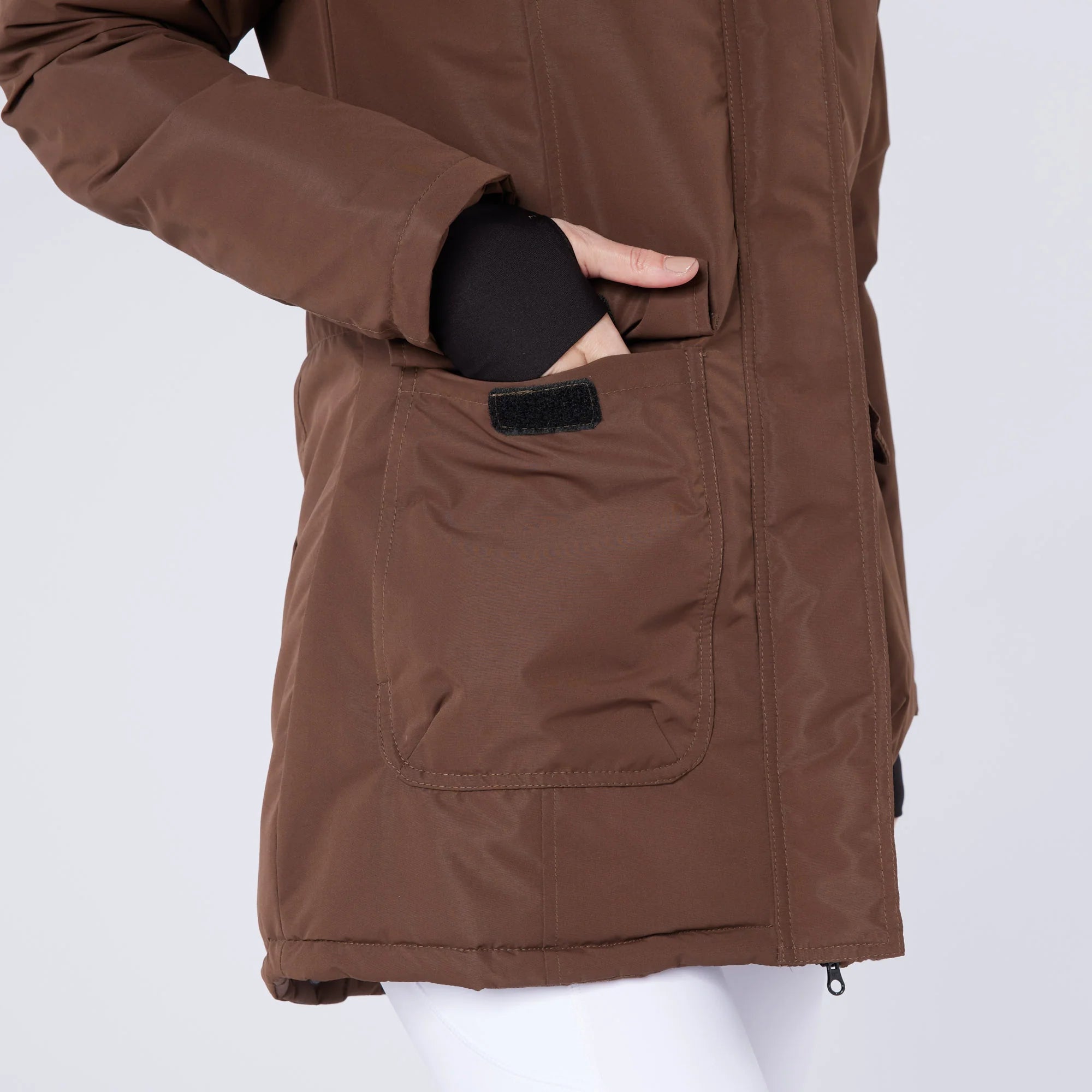 Equiflair brown quilted riding jacket with hand in pocket, vented, hooded, front pockets. For women riders.