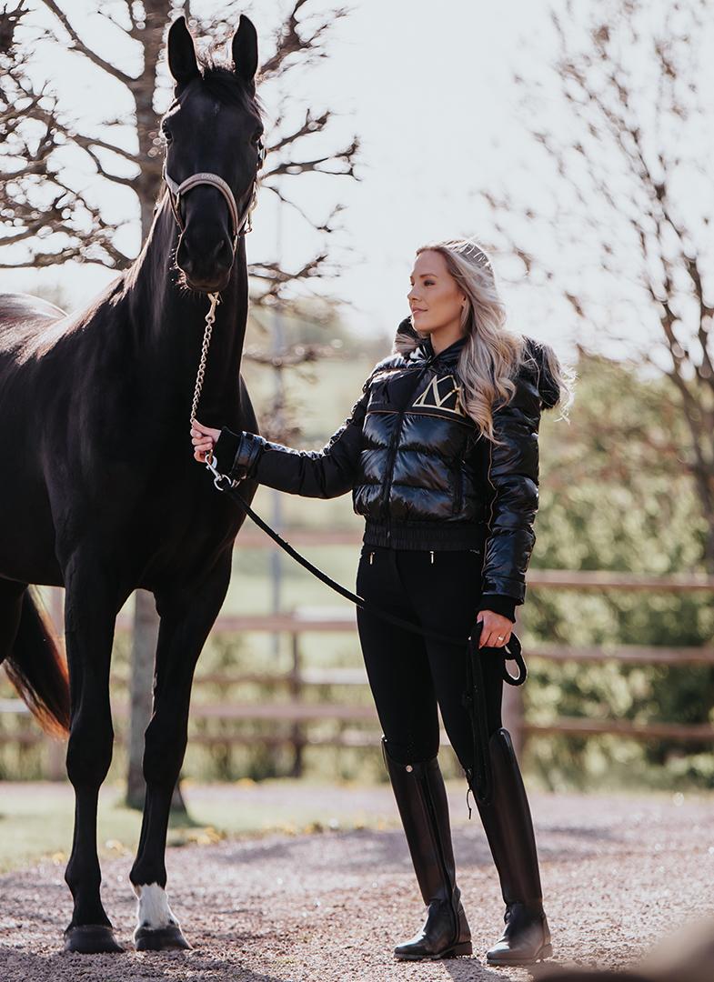 Equestrian Style: Woman with Black Horse in Mountain Horse Diamond Padded Jacket - Equiflair
