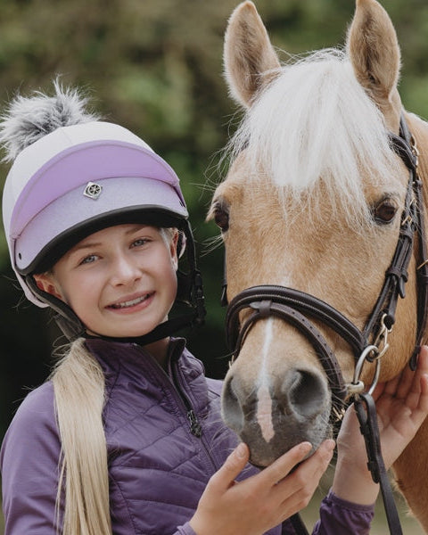 Charles Owen JS1 Pro Lilac Jockey Skull Riding Helmet with girl and horse. Equestrian safety helmet from Equiflair.