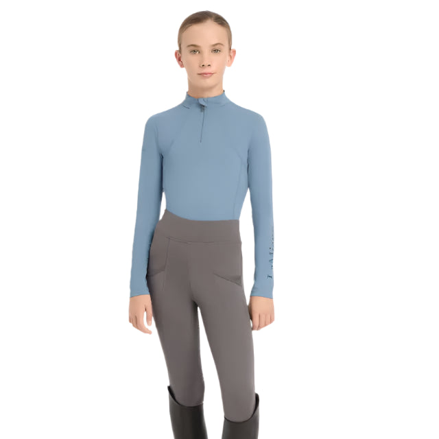 Lemieux Young Rider Base Layer Ice Blue: Equestrian performance top with UV protection for active riders.