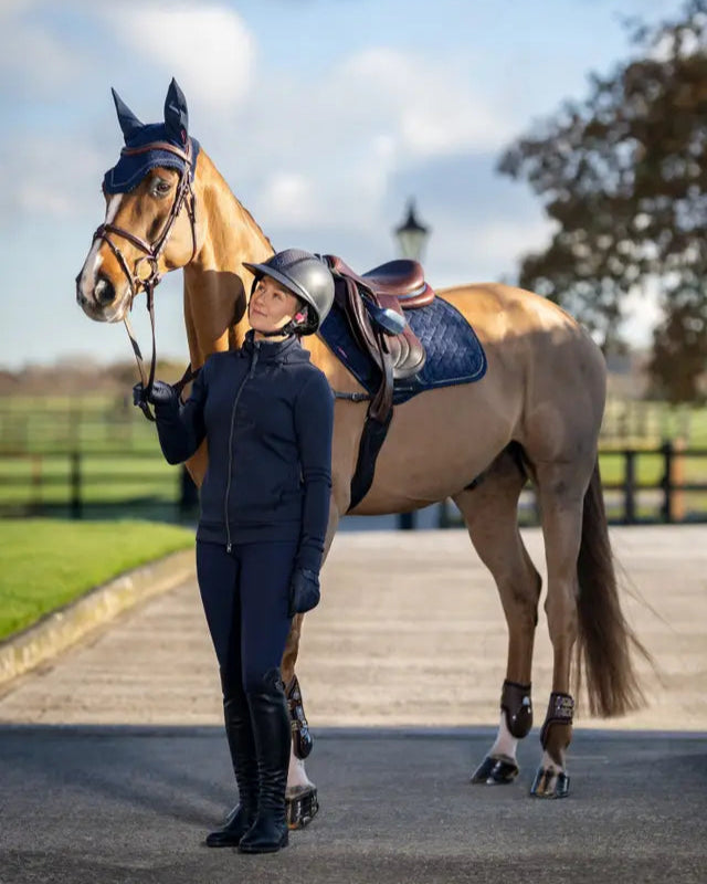 LeMieux Crystal Fly Hood Navy: Horse with ear net and woman rider in matching equestrian outfit. Equiflair store.