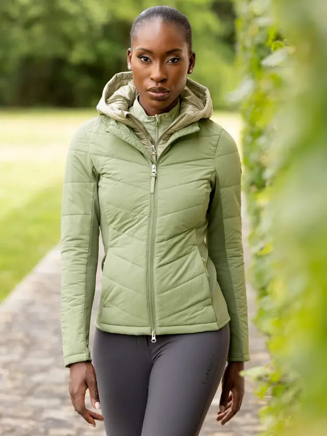 LeMieux Brioney Hybrid Jacket Thyme: Water-repellent, insulated hood, flexible warmth. Stylish & functional riding wear. Equiflair