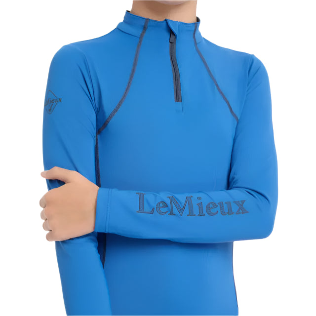 LEMIEUX Young Rider Base Layer Benetton Blue: UV50+, Quarter Zip, Long Sleeve Performance Shirt for Horse Riding. Shop at Equiflair!