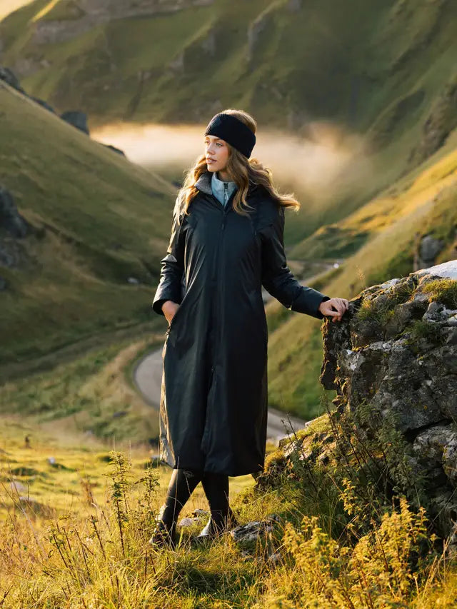 Lemieux All Elements Navy Waterproof Coat: Woman in equestrian outdoor wear in nature. Rainproof riding jacket. Equiflair store.