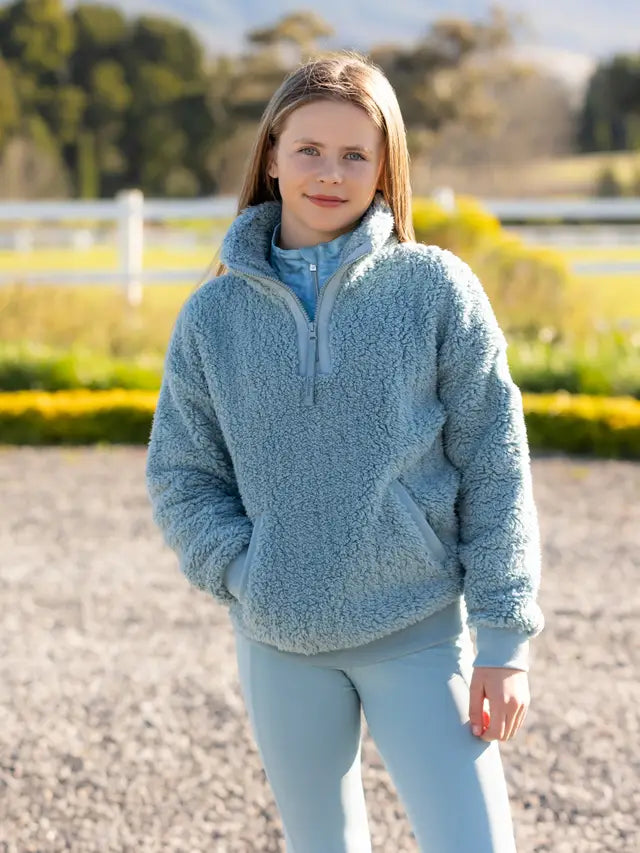 Lemieux Young Rider Tia Teddy Fleece Glacier - Girl wearing a cozy blue fleece jacket