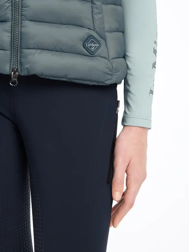 LeMieux Young Rider Milly Puffer Gilet - Petrol Equestrian Vest. Water-resistant, recycled down fill, detachable hood