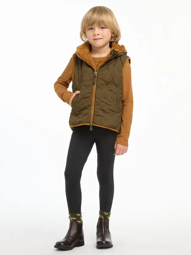 LeMieux Mini Elsie Reversible Gilet Alpine - Girl in Quilted Vest and Riding Boots - Equiflair