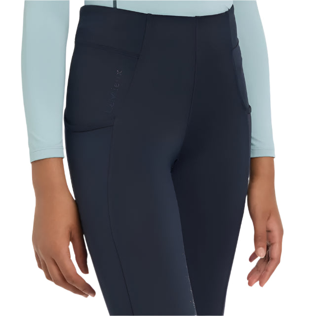 Lemieux Young Rider Orla Navy Pull Ons: Technical riding leggings with pockets, full seat grip, and comfortable fit for active kids.