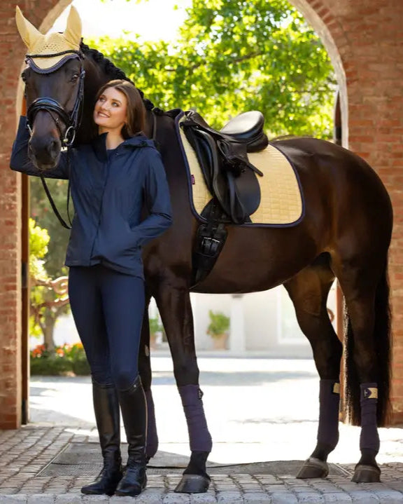 Lemieux Suede Dressage Square Mimosa at Equiflair: Horse saddle pad in Mimosa color, showcasing equestrian style & comfort.