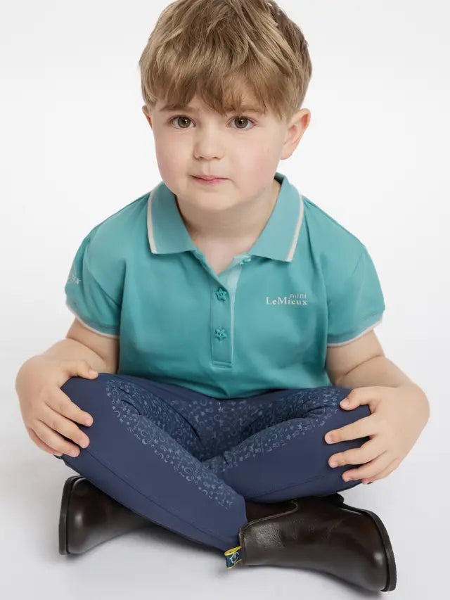 LeMieux Mini Polo Shirt Lagoon: Stylish children's equestrian clothing for young riders, available at Equiflair.