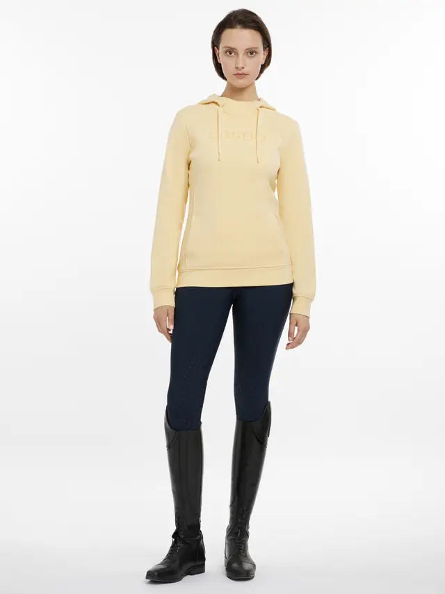 Lemieux Martha Hoodie in Mimosa Yellow with Riding Leggings and Boots. Equiflair Store.