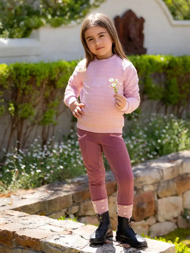 LeMieux Mini Cici Crew Blossom: Girl in pink riding sweater & tights. Children's equestrian apparel by Equiflair.