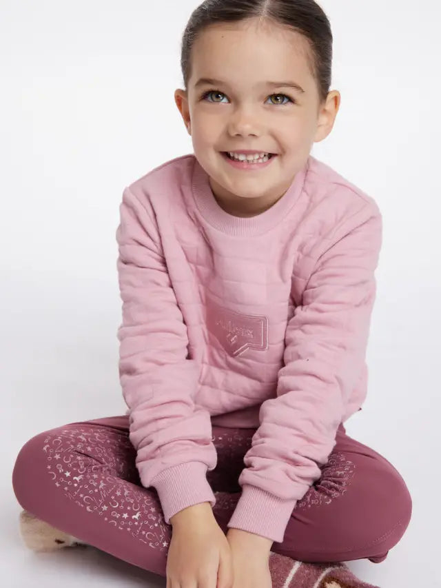 LeMieux Mini Cici Crew Blossom: Girl in pink quilted sweatshirt & equestrian print leggings. Equiflair.