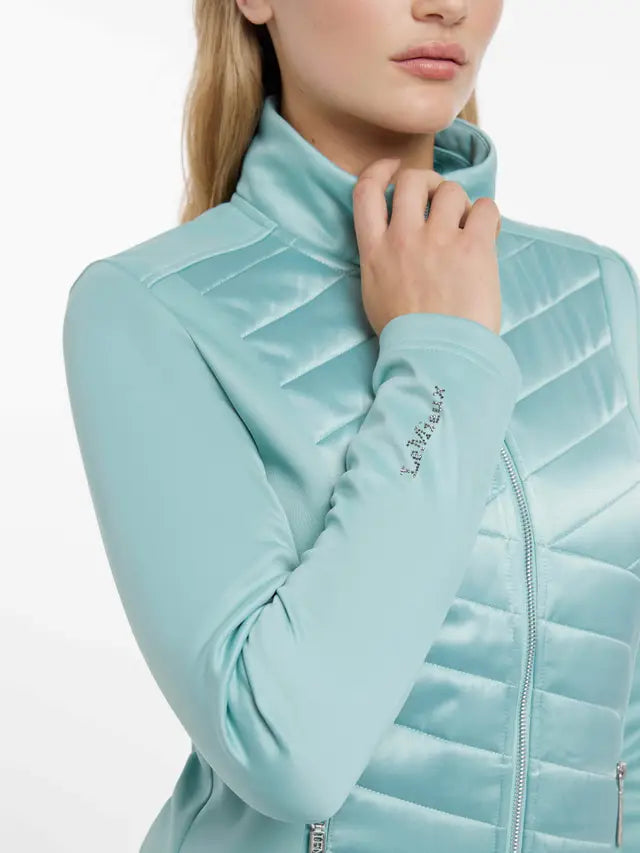 LeMieux Dynamique Aqua Jacket: Stylish equestrian outerwear with chevron padding and flattering fit. Find at Equiflair!