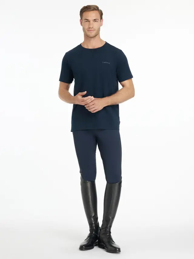 LEMIEUX Mens Navy T-Shirt: Man wearing a navy tee, riding breeches, and tall riding boots.