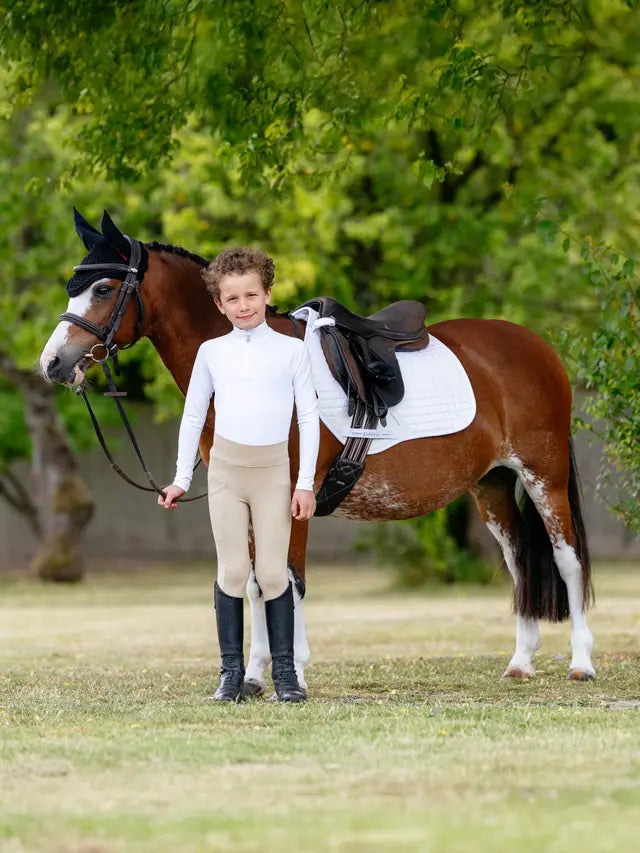 Boy and Pony with LeMieux Mini Suede Close Contact Square White Saddle Pad - Equiflair Horse Riding Outfit
