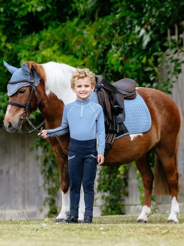 Equestrian Image: Boy with Pony Wearing LEMIEUX MINI SUEDE CLOSE CONTACT SQUARE ICE BLUE pad