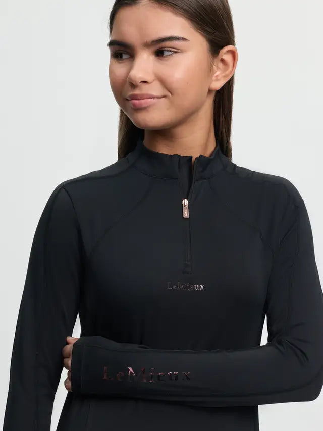 Young rider in black LeMieux sparkle base layer with rose gold details