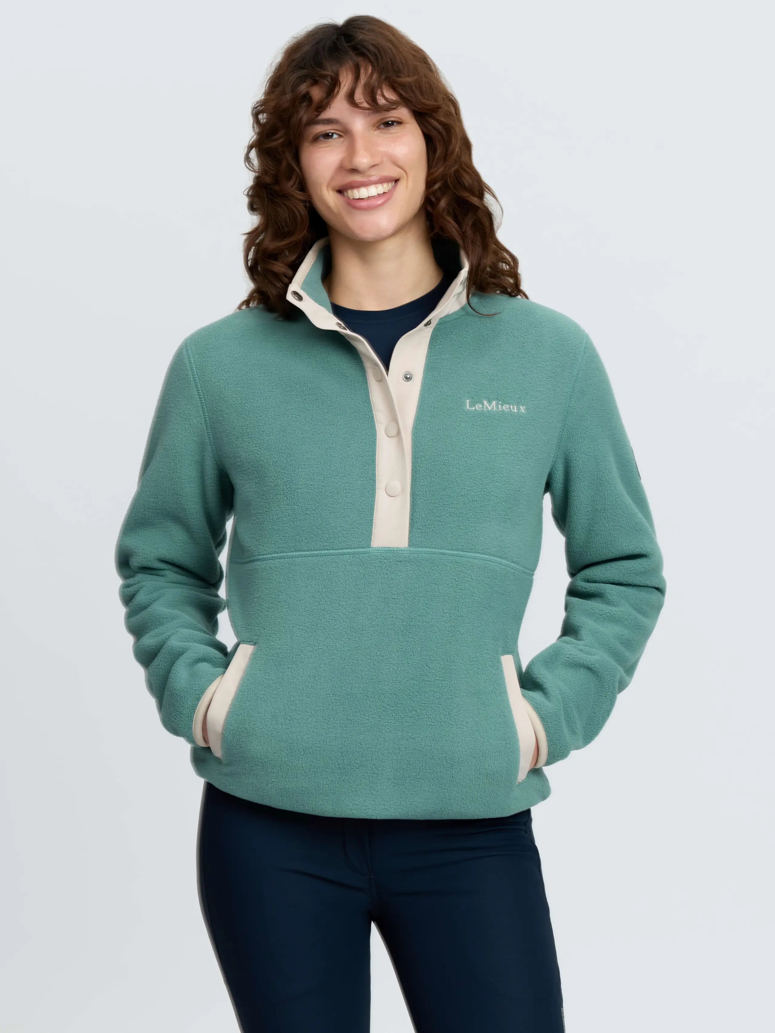 LeMieux Piper Popper Fleece Aloe green women's mid-layer fleece with contrast detail and pockets.