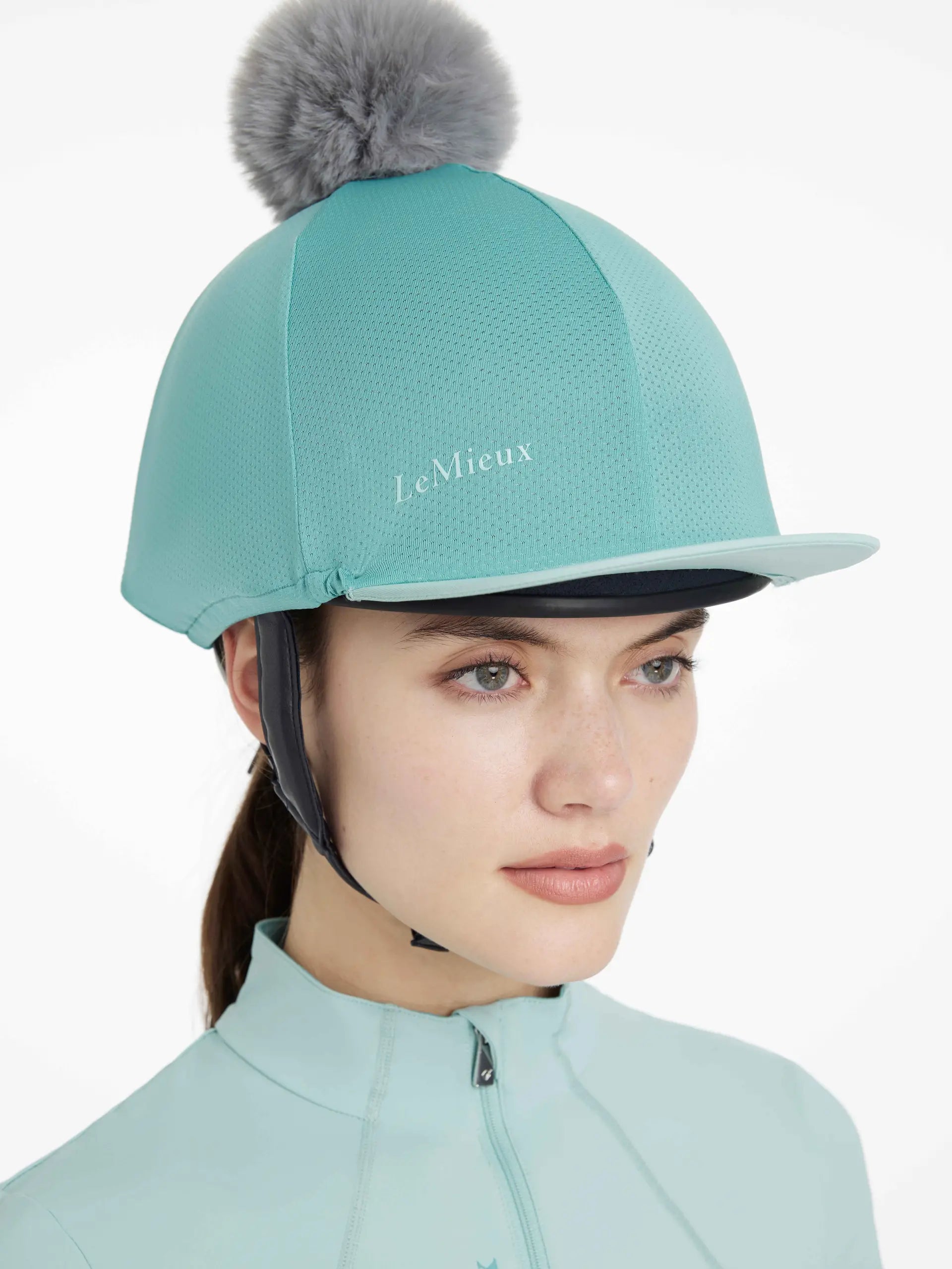 LeMieux Maria Mesh Hat Silk Lagoon - Equestrian Riding Helmet Cover with Pom Pom