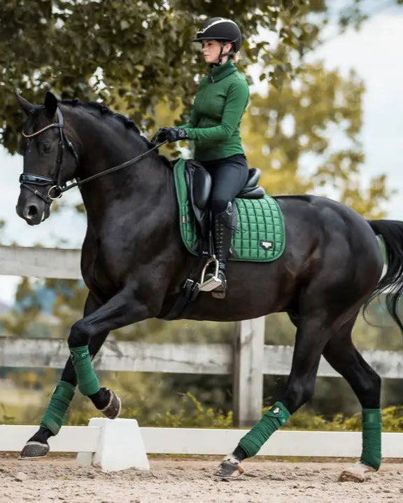 LeMieux Loire Dressage Square Hunter Green: Woman Riding Black Horse. Equestrian Sport