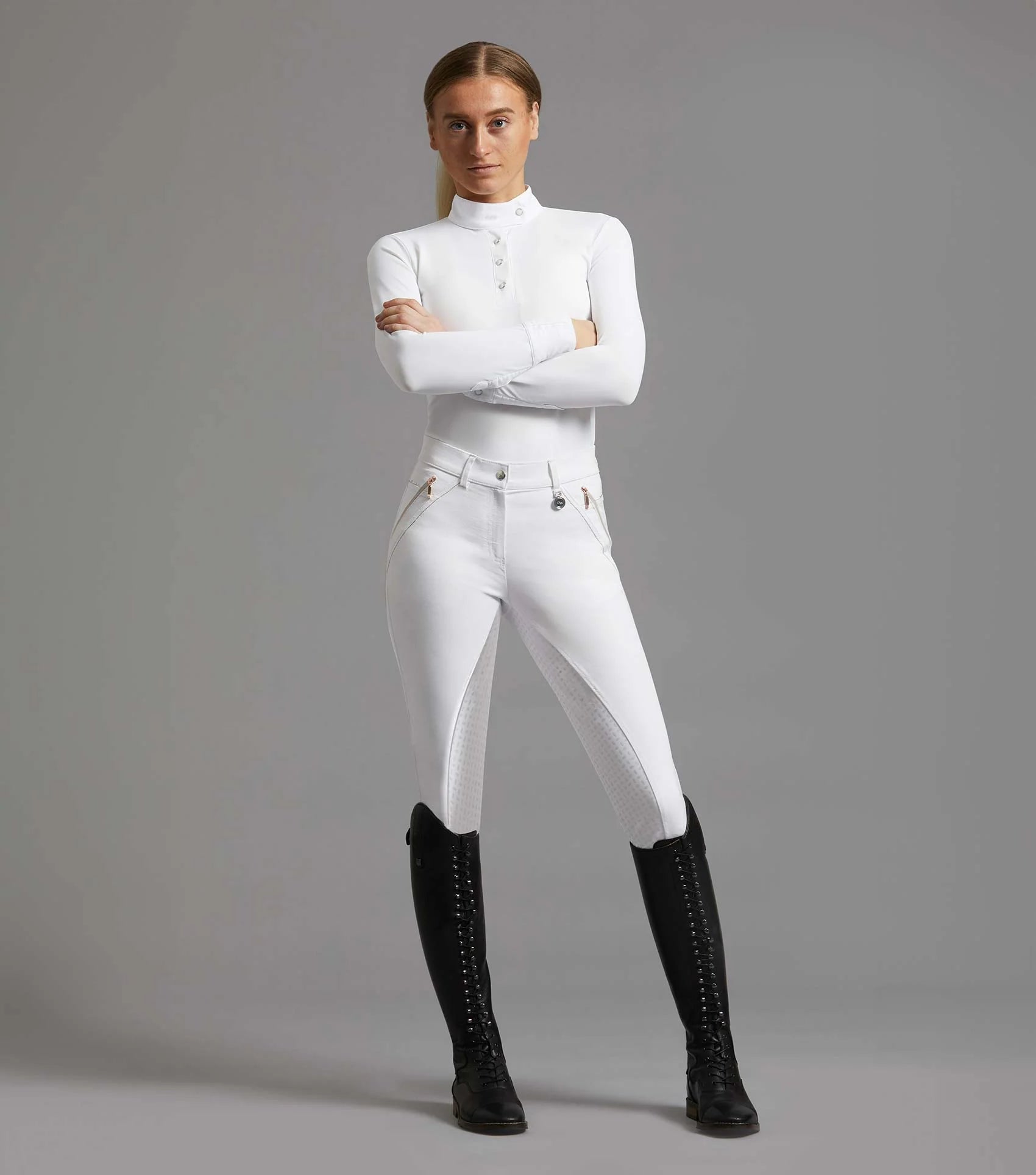 Equestrian Woman in Premier Equine Milliania White Riding Breeches & Black Boots by Equiflair: Competition Horse Riding Apparel