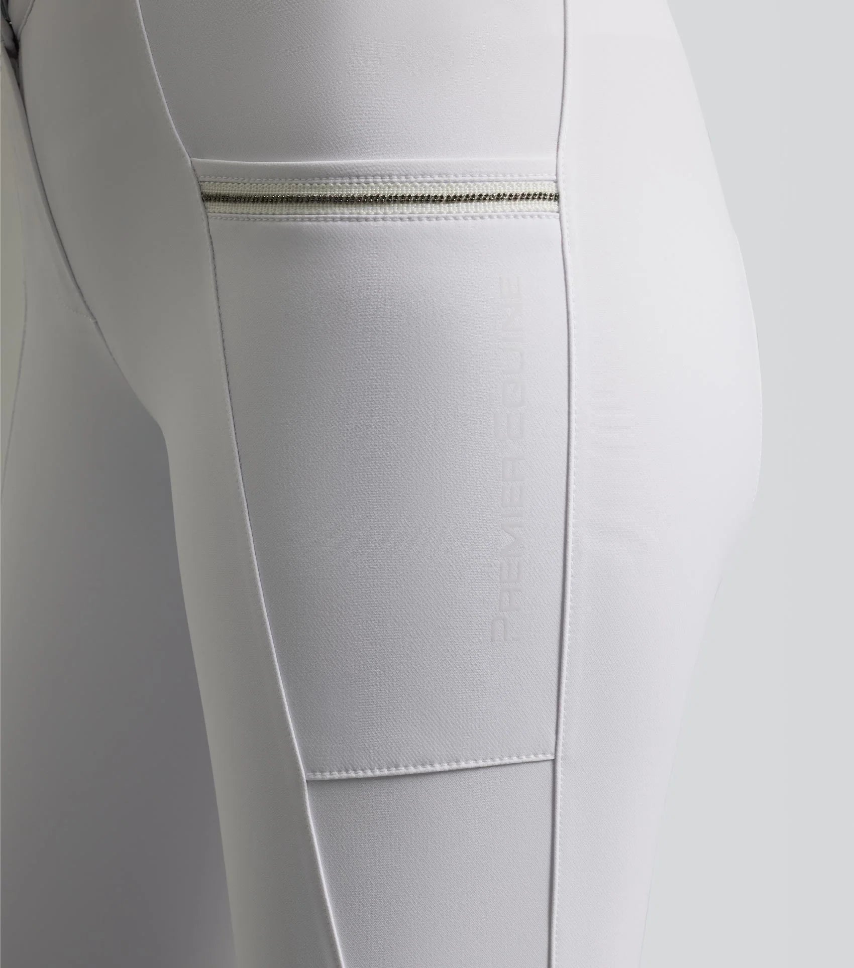 Premier Equine Ofena White Riding Breeches: Gel Knee, Competition, Phone Pockets. Equestrian Apparel by Equiflair