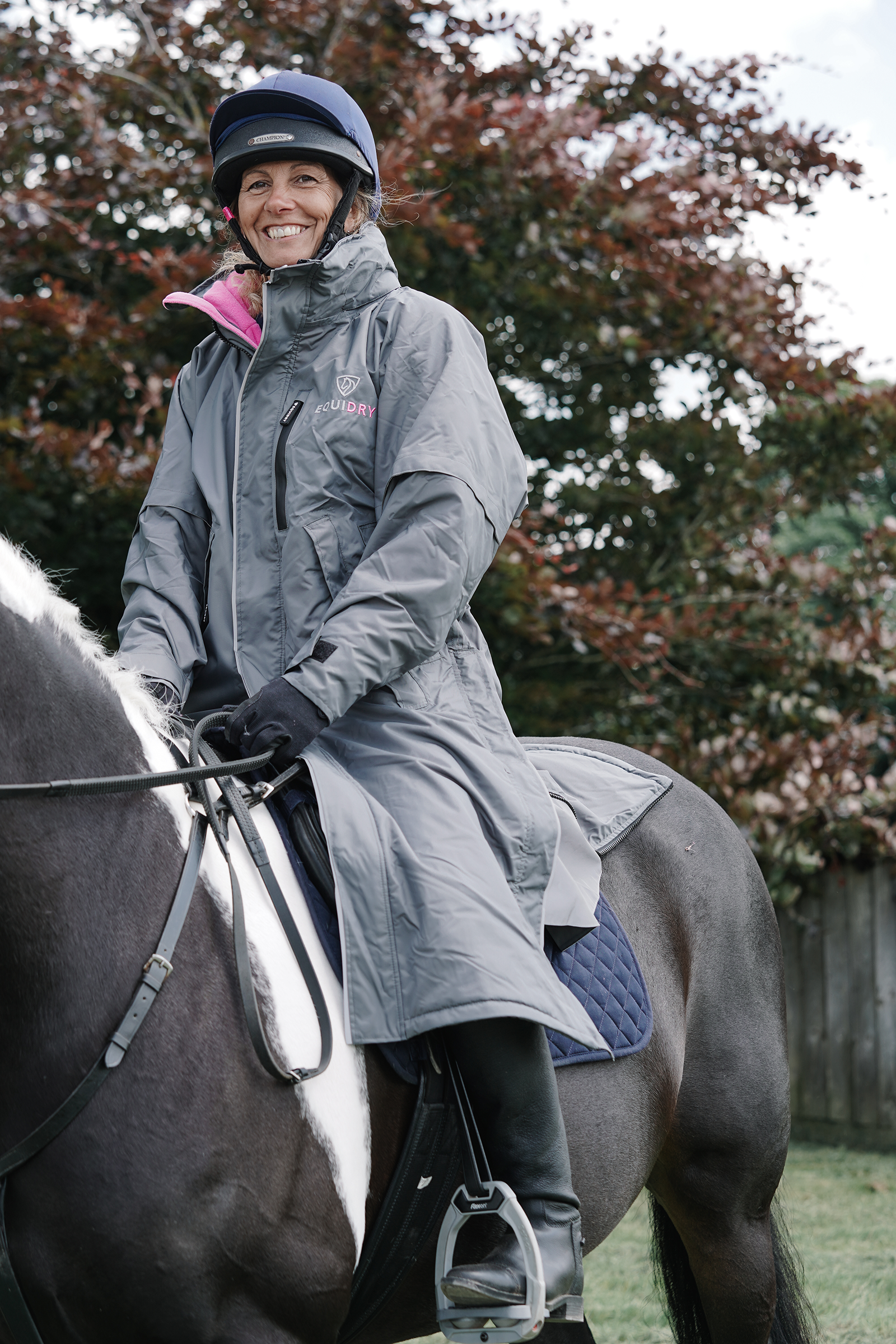 EQUIDRY waterproof horse riding raincoat thin fleece pro ride reflective charcoal/pale pink rider on horse
