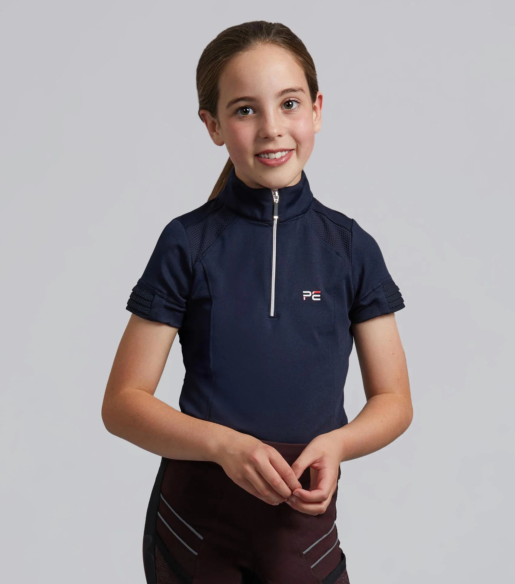 Girl in Premier Equine Navy Riding Top - Equestrian Apparel, Short Sleeve Shirt for Junior Riders