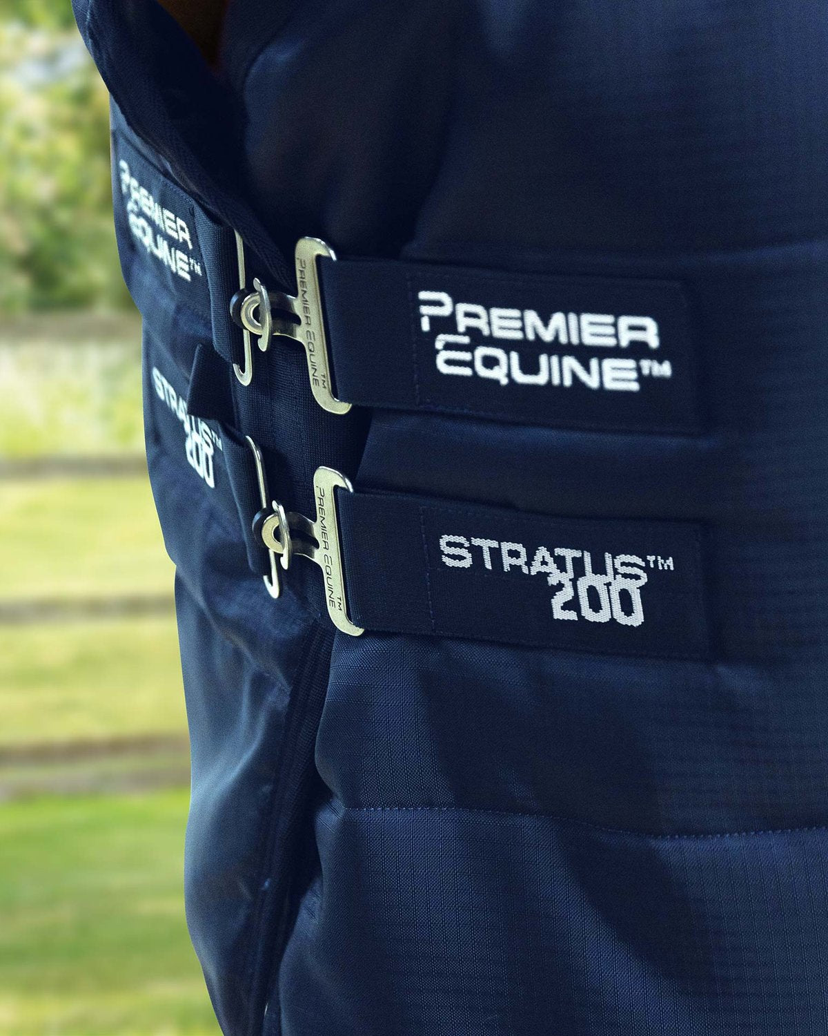 Premier Equine Stratus 200g Stable Rug: Close-up of Straps and Branding