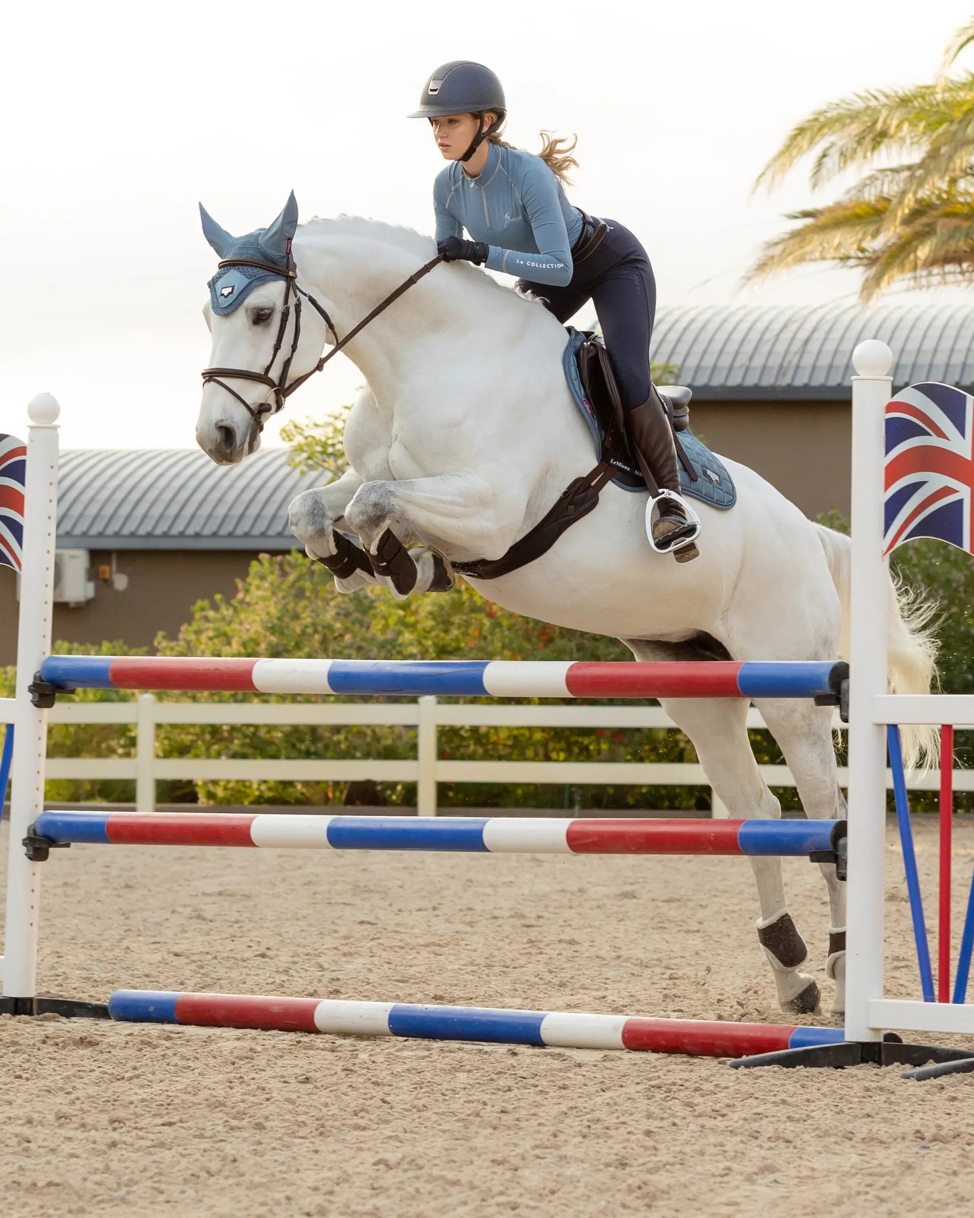 Horse Jumping: Equestrian in Action with LeMieux Ice Blue Saddle Pad by Equiflair. #HorseJumping #LeMieux #Equestrian #SaddlePad