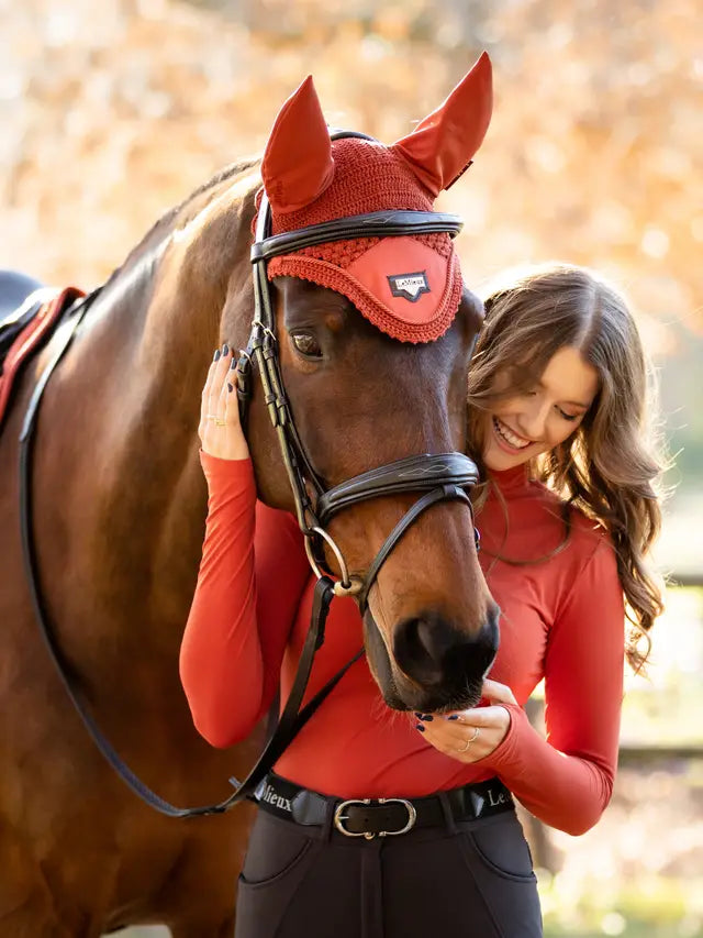 LeMieux Loire Fly Hood Sienna on Horse with Woman. Equestrian Fashion.