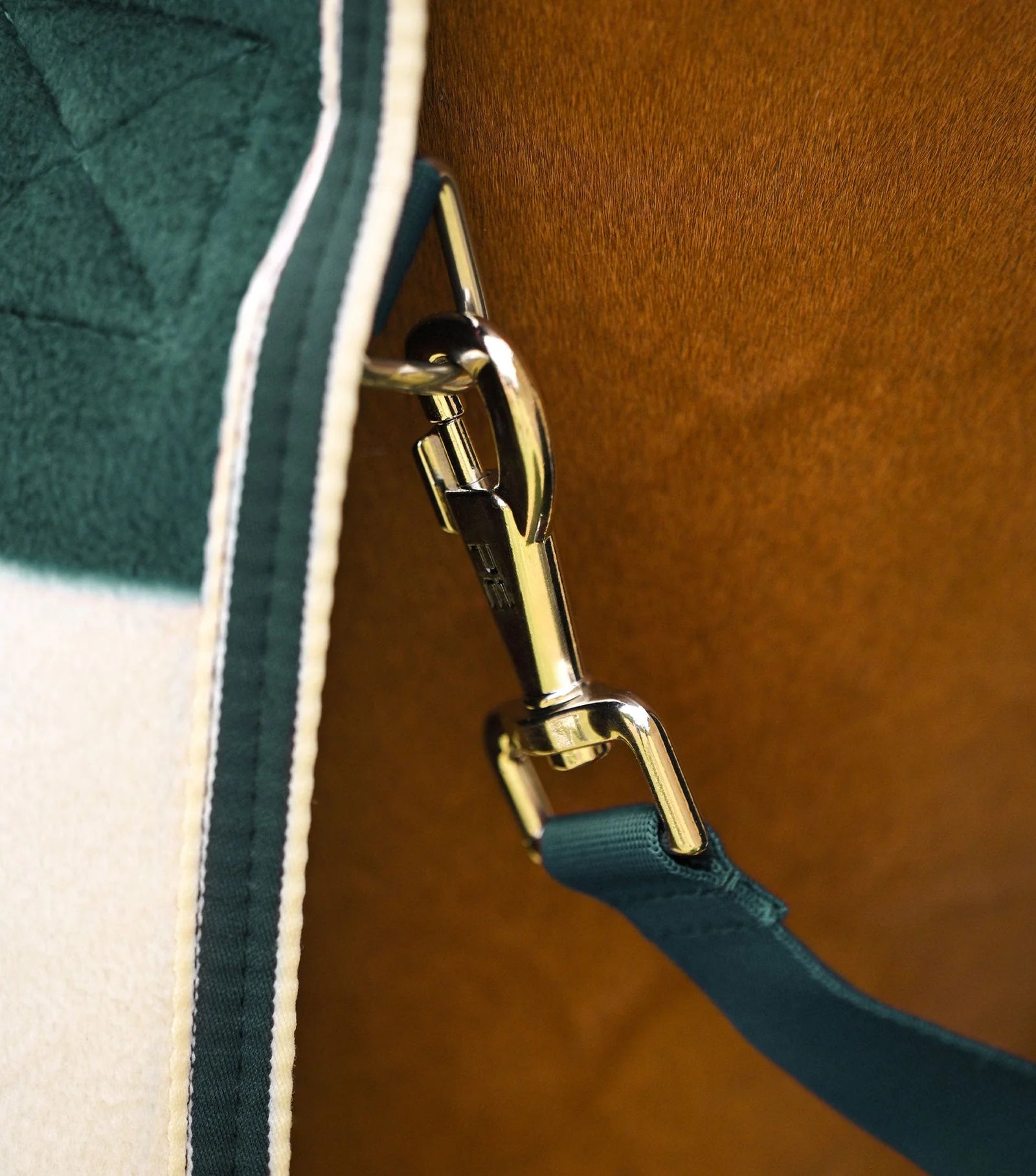 Equiflair horse fleece rug, green and white color. Premier Vellus cooler rug close up.