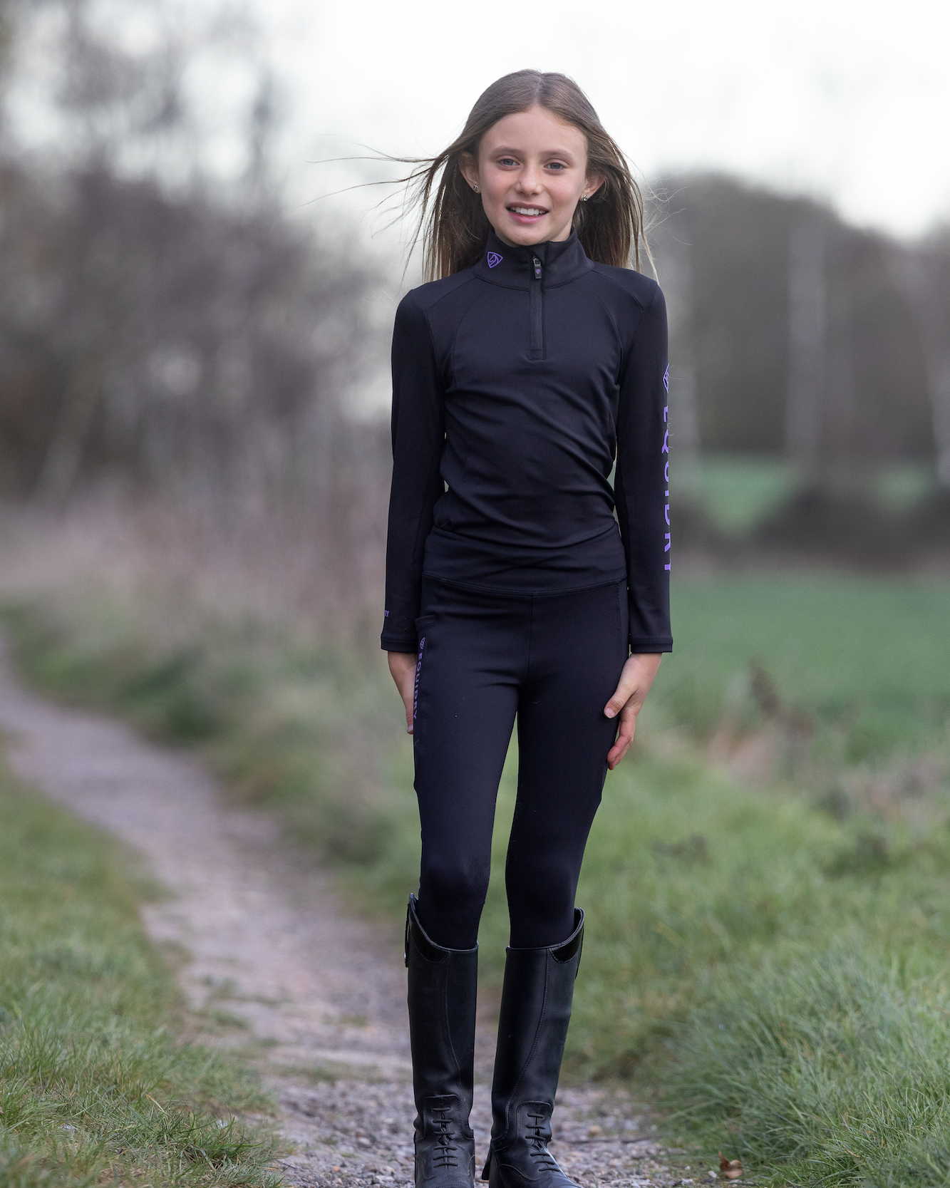 Equiflair Girl in EQUIDRY Equestrian Base Layer: Children's Water Repellent Riding Clothes Black/Lilac