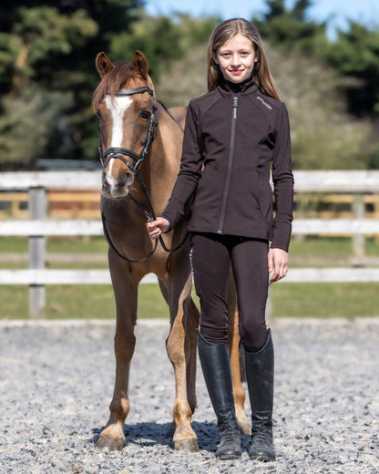 Girl in Equidry Riding Gear with Horse | Brown Water-Repellent Jacket | Kids Equestrian Fashion