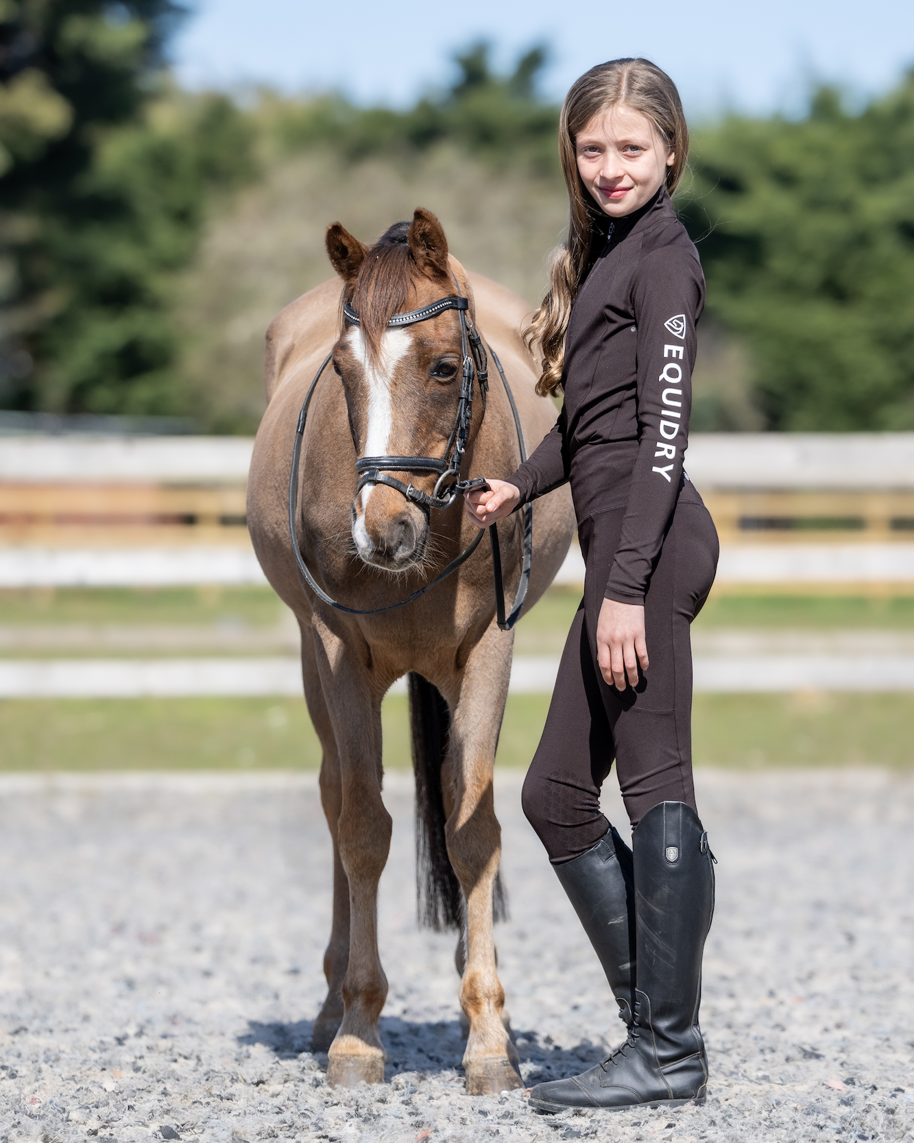 Child rider with pony in EQUIDRY equestrian leggings by Equiflair. Horse riding apparel, kids equestrian style.