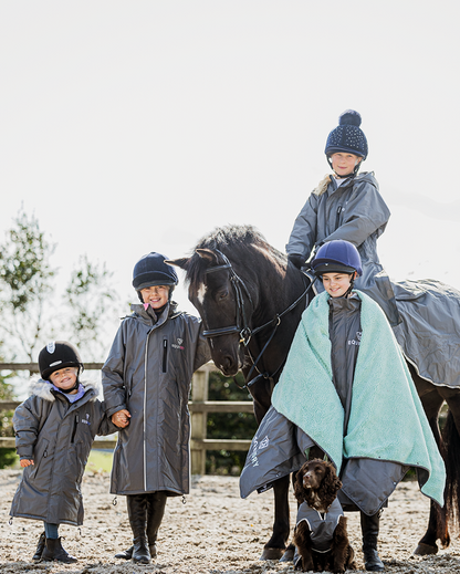 EQUIDRY waterproof horse riding raincoat thin fleece pro ride reflective in charcoal/pale pink children's grey family photo in arena