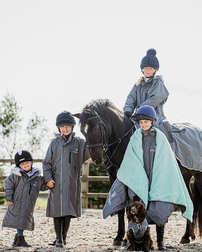 EQUIDRY waterproof horse riding raincoat thin fleece pro ride reflective in charcoal/pale pink children's grey family photo in arena
